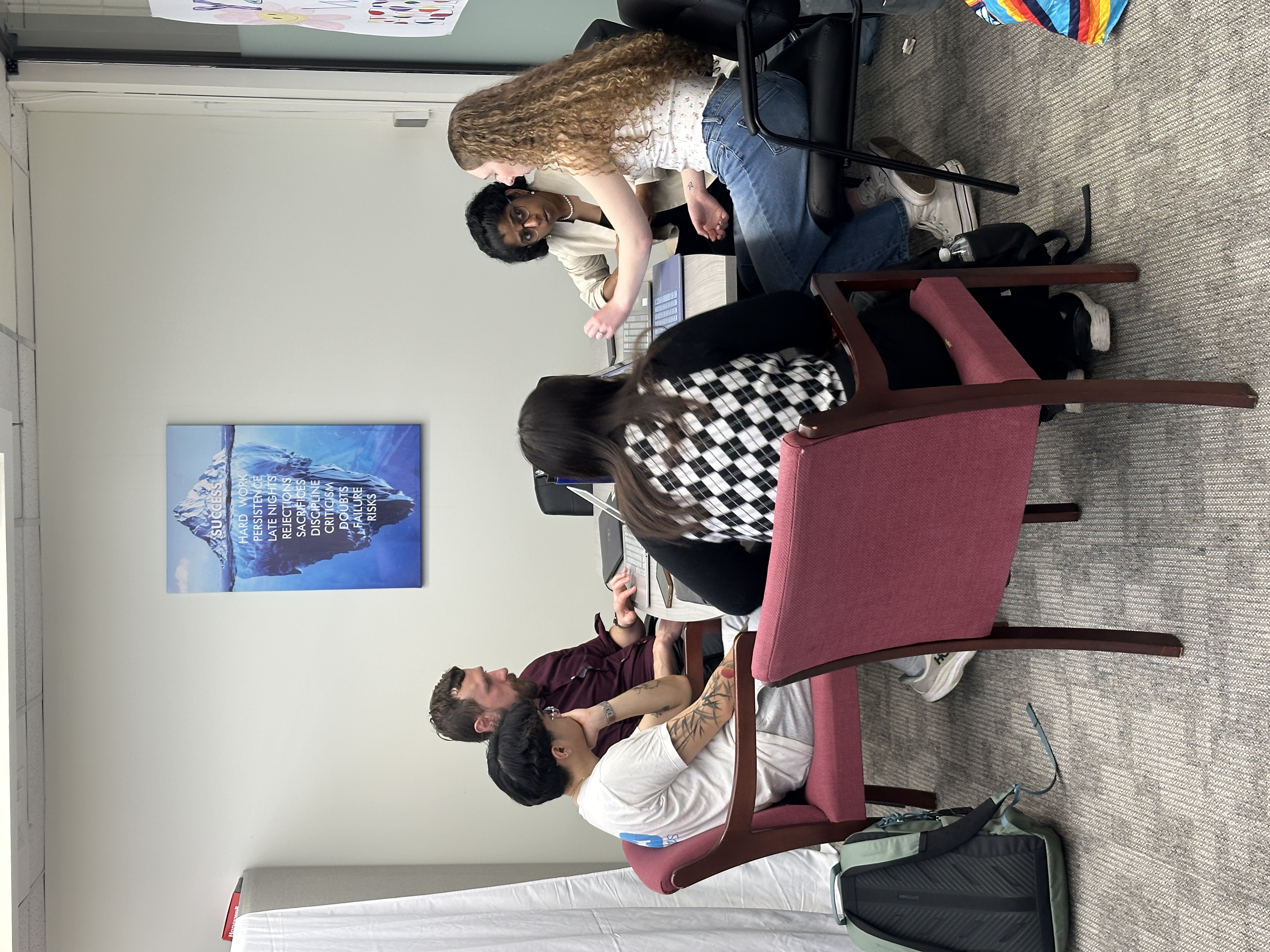 people sitting around a table talking